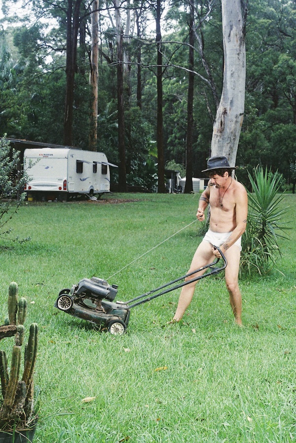 WaltSin mowing the lawn in a hat and underpants — a film photograph