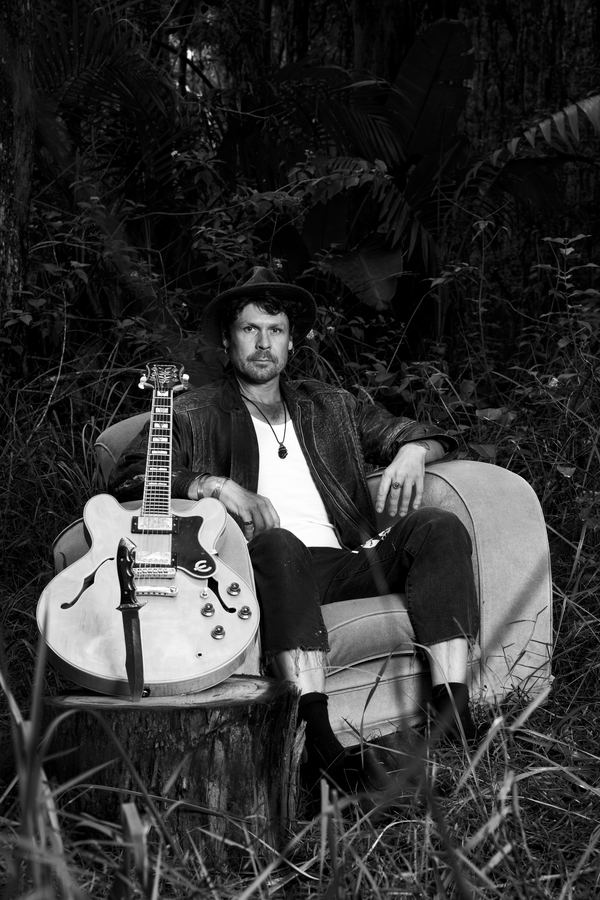 WaltSin promo photo — Couch — Stare, B&W